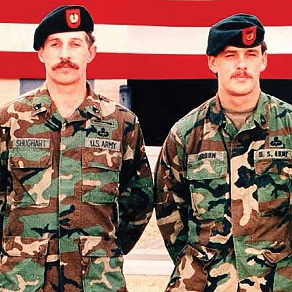 Portraits of Randy Shughart on the left and Gary Gordon on the right.