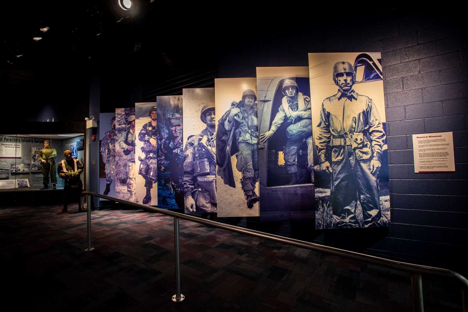 Gallery hallway lined with portraits of Airborne and Special Operations Soldiers
