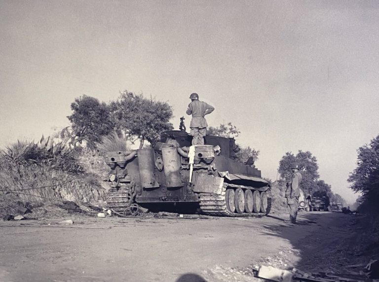82nd troopers inspect German “Tiger” tank near Gela, Sicily. The tank was knocked out during battle between 505th and Hermann Goering Panzer Division.