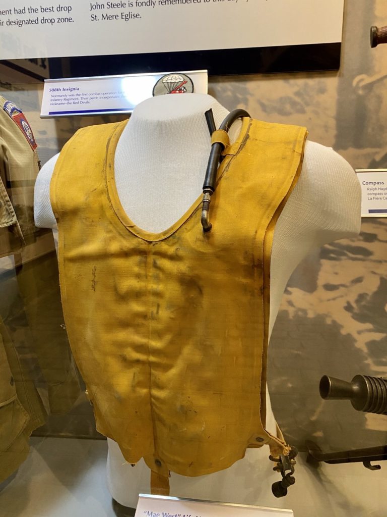 “Mae West” Life Vest: Despite life vests like this, the 507th PIR suffered the worst drop of the day when 25 troops drowned after being dropped into rivers and marshes.
