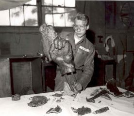 PFC Zintars Zamelis sculpting one of the statue's hands